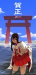  2011 copyright_request hakama_skirt japanese_clothes miko skirt skirt_lift solo torii wading yoshiki_ryouma 