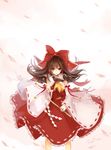  ascot bell blush bow brown_eyes brown_hair cowboy_shot detached_sleeves frilled_bow frills gohei hair_bow hair_ribbon hair_tubes hakurei_reimu highres holding issign jingle_bell long_hair looking_at_viewer ofuda outstretched_hand petals reaching_out red_bow red_ribbon red_skirt red_vest ribbon ribbon-trimmed_clothes ribbon-trimmed_sleeves ribbon_trim skirt skirt_lift skirt_set smile solo touhou vest white_ribbon wide_sleeves wind wind_lift yellow_neckwear 