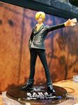  1boy black_pants black_shoes blonde_hair cigarette facial_hair figure formal goatee grin hair_over_one_eye hand_in_pocket jolly_roger male male_focus mustache necktie one_piece pants photo pirate sanji shirt shoes smile solo suit yellow_shirt 