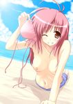  ahoge arched_back arm_support barefoot beach bikini_top blush breasts brown_eyes cloud collarbone day foreshortening holding holding_bikini_top long_hair lying medium_breasts navel nipples nirap ocean on_stomach one_eye_closed original outdoors pink_hair sky smile solo topless water 