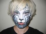  bodypaint facepaint feline female human portrait real solo tiger unknown_artist 