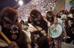  canine carnaval carnival drum fursuit human mammal musical_instrument nightmare_fuel parade photo real rio_de_janeiro snare_drum wolf 