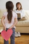  absurdres age_difference asian back blurry child computer couch denim depth_of_field english heart highres holding huge_filesize japanese jeans laptop long_hair mother_and_daughter pants photo shoes sitting smile sofa standing 