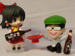  1girl artist_request ascot black_hair blush bottle brown_eyes cup detached_sleeves dress dress_shirt drunk figure glasses hair_tubes hakurei_reimu hat nendoroid photo red_dress sakazuki shirt short_hair skirt smile touhou yin_yang zun 