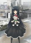  bangs bare_tree black_hair blue_eyes blunt_bangs building crosswalk doll_hug dress gothic_lolita kami-sama_no_memo-chou lolita_fashion long_hair looking_at_viewer pantyhose power_lines prime road_sign shionji_yuuko sign snow snowing solo standing stuffed_animal stuffed_toy teddy_bear traffic_light tree very_long_hair 