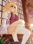  bare_legs barefoot blonde_hair breasts feet grass hat highres impossible_clothes large_breasts lens_flare long_hair nanase_nanami outdoors red_eyes sitting solo sun touhou yakumo_yukari 