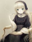  blonde_hair book chitosezaka_suzu gosick gothic_lolita green_eyes hairband highres lolita_fashion pipe sitting solo victorica_de_blois wide_sleeves 