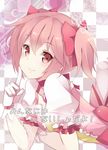  arm_support checkered checkered_background cheekbones doily gloves hair_ribbon kaname_madoka kujou_ichiso lips looking_at_viewer lying magical_girl mahou_shoujo_madoka_magica on_stomach pink_eyes pink_hair ribbon short_twintails smile solo translated twintails 