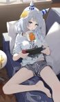 1girl alternate_costume animal_ears bare_legs barefoot breasts brown_eyes commentary couch desk ear_covers ear_ornament feet foot_out_of_frame grey_hair grey_shorts highres hishi_miracle_(umamusume) horse_ears horse_girl horse_tail indoors juice_box legs looking_at_viewer medium_breasts medium_hair ningen_gokko nintendo_switch on_couch open_mouth pillow shirt short_shorts short_sleeves shorts smile solo tail toenails toes umamusume white_shirt 