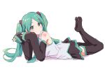  1girl aqua_eyes aqua_hair aqua_nails aqua_necktie aqua_trim bare_shoulders black_sleeves black_thighhighs feet feet_up full_body grey_shirt hatsune_miku highres legs_up looking_at_viewer lying necktie no_shoes on_stomach parted_bangs shirt shoulder_tattoo sleeves_past_wrists soles solo tattoo the_pose thighhighs twintails vocaloid yakkl 