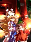  absurdres animal_ears blonde_hair brown_eyes brown_hair cat_ears cat_tail chen earrings fang fox_tail hands_in_opposite_sleeves highres jewelry multiple_girls multiple_tails nunua ofuda red_eyes short_hair single_earring tail torii touhou yakumo_ran 