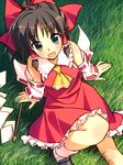  arm_support blue_eyes bow brown_hair detached_sleeves from_above grass hair_bow hakurei_reimu highres looking_at_viewer looking_up open_mouth short_hair smile solo touhou yuuki_keisuke 
