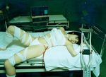  1girl asian bandage bandages bed black_hair crutch crutches highleg highleg_panties hospital hospital_bed indoors looking_at_viewer panties photo solo underwear 