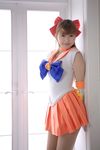  aino_minako bishoujo_senshi_sailor_moon blonde_hair bow cosplay elbow_gloves fang gloves hair_bow hairbow highres kumi photo sailor_venus 