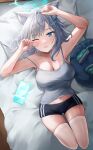  1girl absurdres animal_ear_fluff animal_ears bed bed_sheet black_shorts blue_archive blue_eyes blue_halo blush breasts camisole cellphone cleavage cross_hair_ornament extra_ears grey_camisole grey_hair hair_ornament halo highres looking_at_viewer m0_0m_c medium_breasts medium_hair navel one_eye_closed open_mouth phone pillow shiroko_(blue_archive) shorts smartphone solo thighhighs white_thighhighs wolf_ears 