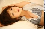  1girl bed bed_sheet bra breasts brown_hair cleavage hoshino_aki japanese lingerie lying photo sheets short_hair squeezing underwear 