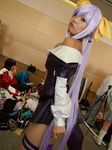  arc_system_works beltbra bow brabelt cosplay dizzy dress guilty_gear hair_bow hair_bows onihara_akira open_clothes open_dress photo purple_hair thigh-highs thighhighs 