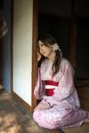  1girl barefoot bracelet dress floral_print japanese_clothes jewelry kimono kouya_(model) lace-trimmed_dress obi photo pink_dress print_dress print_kimono sash side_ponytail sitting solo yukata 