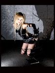  1girl amane_misa blade blades blonde_hair cosplay death_note elbow_gloves fishnet_legwear fishnet_stockings fishnets gloves highres indoors kipi-san lace legwear looking_at_viewer photo small_breasts smile solo thigh-highs thighhighs torn_clothes twintails 