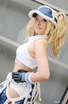  blonde_hair blue_eyes blue_mary chaps cosplay gloves halter_top halterneck king_of_fighters kof:_maximum_impact long_hair midriff nogu photo snk solo the_king_of_fighters twintails 