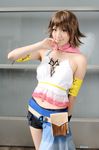  1girl belt cape cosplay final_fantasy final_fantasy_x final_fantasy_x-2 finger_to_mouth halter_top halterneck midriff navel photo saya saya_(cosplayer) shorts smile solo yuna yuna_(cosplay) 