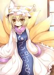  animal_ears blonde_hair breasts dress fox_ears fox_tail hat highres medium_breasts multiple_tails ncatabc short_hair sitting smile solo tail touhou yakumo_ran yellow_eyes 