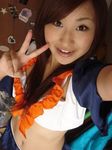  1girl ayaka brown_hair cheerleader cosplay japan long_hair lowres midriff photo smile solo v 