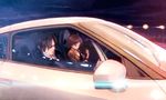  1girl brown_hair car driving ground_vehicle hoshii_miki idolmaster idolmaster_(classic) jewelry motor_vehicle nissan nissan_gt-r producer_(idolmaster_anime) reflection right-hand_drive ring short_hair sunglasses tsukigami_runa 