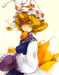  aburaage bad_id bad_pixiv_id blonde_hair food fox_tail hat long_sleeves mouth_hold multiple_tails pillow_hat short_hair solo tail tassel touhou wide_sleeves yakumo_ran yellow_eyes yukizen 