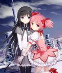  akemi_homura antenna_mast argyle argyle_legwear bangs black_hair black_hairband black_legwear black_neckwear black_ribbon bow building capelet choker cloud eyebrows_visible_through_hair gloves grey_skirt hair_bow hairband heart_cutout high_heels highres holding_hands kaname_madoka kneehighs long_hair long_sleeves looking_at_viewer looking_back magical_girl mahou_shoujo_madoka_magica multiple_girls neck_ribbon night night_sky outdoors pantyhose pink_eyes pink_hair pink_skirt pleated_skirt puffy_dress puffy_short_sleeves puffy_sleeves purple_eyes red_bow ribbon ribbon_choker shirt shoe_bow shoes short_sleeves skirt sky skyscraper smile standing standing_on_one_leg star_(sky) thighhighs tower tucana twintails very_long_hair white_legwear 