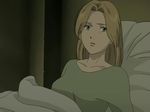  anna_liebert bed blonde_hair collarbone long_hair looking_away monster_(manga) non-web_source pillow screencap solo 