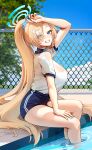  1girl absurdres asuna_(blue_archive) bare_legs blonde_hair blue_archive blue_buruma blue_eyes blue_sky blush breasts buruma chain-link_fence fence foxyreine grin gym_shirt hair_over_one_eye halo highres large_breasts legs long_hair looking_at_viewer ponytail pool poolside shirt short_sleeves sitting sky smile soaking_feet solo tree very_long_hair white_shirt 