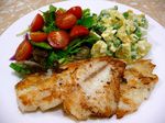  cooked fish food peas photo plate salad tomato tomatoes 