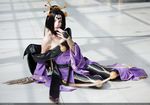  1girl bare_shoulders bat_(symbol) black_hair cosplay digimon facial_mark female lilithmon nail_polish on_floor photo purple_nails sitting solo 