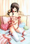  :d absurdres blush breasts brown_eyes brown_hair flipped_hair heart heart_pillow heart_print highres ikegami_akane long_legs makiya_kasumi medium_breasts naked_ribbon navel official_art open_mouth pillow polka_dot ribbon sitting smile solo striped thighhighs wariza white_legwear with_ribbon 