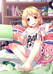  barefoot bed blonde_hair bottle can clothes_writing coca-cola computer feet flag_print furrowed_eyebrows futaba_anzu handheld_game_console hands highres idolmaster idolmaster_cinderella_girls kago_no_tori laptop long_hair off_shoulder pillow playstation_portable print_pillow red_eyes shirt soda_bottle soda_can solo t-shirt toes translated union_jack you_work_you_lose 