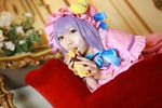  1girl asian cosplay couch cream crescent dessert dress female food hat long_hair patchouli_knowledge photo purple_hair solo tenshi_myu touhou 