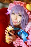  1girl asian cosplay couch cream crescent dessert dress female food hat highres long_hair patchouli_knowledge photo purple_hair solo tenshi_myu touhou 