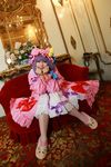  1girl asian bow carpet chandelier cosplay couch crescent dress female hat highres long_hair mirror mob_cap patchouli_knowledge photo purple_hair red_upholstery ribbon slippers solo table tenshi_myu thighhighs touhou white_dress 