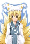  animal_ears blonde_hair fox_tail hands_in_opposite_sleeves hat kyuubi long_sleeves multiple_tails pillow_hat short_hair snowdust_(pixiv) solo tail tassel touhou wide_sleeves yakumo_ran 