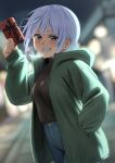  1girl alternate_costume blue_eyes blurry blurry_background blush chris_(konosuba) commentary denim dutch_angle fang gift green_jacket grey_hair grin hand_in_pocket highres holding holding_gift hood hood_down hooded_jacket izawa_(bhive003) jacket jeans kono_subarashii_sekai_ni_shukufuku_wo! open_clothes open_jacket outdoors pants short_hair smile solo sweater_tucked_in teeth 