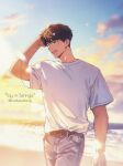  1boy beach belt blue_pants brown_eyes brown_hair cloud cowboy_shot denim english_text gradient_sky hand_in_own_hair highres horizon jeans jeong_taeui light_blush male_focus mistletoebirdy ocean official_style one_eye_closed open_mouth pants passion_(manhwa) shirt short_sleeves sky smile solo white_shirt 