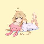  1girl bangs barefoot blonde_hair blush brown_eyes bunny expressionless feet feet_together futaba_anzu highres holding holding_stuffed_animal idolmaster idolmaster_cinderella_girls looking_at_viewer lying messy_hair on_stomach oversized_clothes shirt shorts simple_background solo stuffed_animal stuffed_toy t-shirt yuu_(higashi_no_penguin) 
