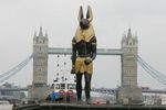  anubis boat bus canine car deity human jackal london sculpture statue thames tower_bridge 