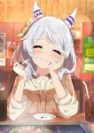  1girl absurdres animal_ears blurry blurry_background blush breasts casual closed_eyes closed_mouth commentary_request drink eating food food_in_mouth grey_hair highres hishi_miracle_(umamusume) horse_ears horse_girl juri-arima medium_breasts medium_hair sitting smile solo table tray umamusume 