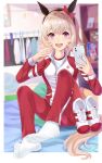  1girl animal_ears blurry blurry_background cellphone curren_chan_(umamusume) evefly_megane_p grey_hair highres horse_ears horse_girl horse_tail jacket long_sleeves looking_at_viewer no_shoes open_mouth pants phone purple_eyes red_jacket red_pants selfie sitting socks solo tail tracen_training_uniform track_jacket track_pants track_suit umamusume variant_set white_socks 