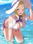  1girl absurdres bikini blonde_hair breasts chaso_(480) cleavage hand_on_headwear hat highres large_breasts layered_bikini leaning_forward looking_at_viewer love_live! love_live!_sunshine!! medium_hair ocean ohara_mari one_eye_closed open_mouth side-tie_bikini_bottom smile solo sun_hat swimsuit water wet white_headwear yellow_eyes 