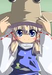  blonde_hair blue_eyes blush eyes frog hands_on_headwear hat looking_at_viewer moriya_suwako satsuki_mei_(sakuramochi) short_hair smile solo touhou 