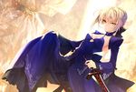  alternate_costume artoria_pendragon_(all) blonde_hair bow breasts cleavage dark_excalibur detached_sleeves dress dress_lift fate/stay_night fate_(series) hachini hair_bow medium_breasts reverse_grip saber_alter short_hair solo sword weapon yellow_eyes 