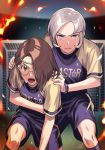  2boys brown_eyes brown_hair dolustoy glasses goal hair_over_one_eye headband highres inazuma_eleven_(series) inazuma_eleven_ares_no_tenbin looking_at_viewer multiple_boys open_mouth purple_eyes shiratori_tsumuki silver_hair soccer_uniform socks sportswear sweat white-framed_eyewear yagihara_katsumi 